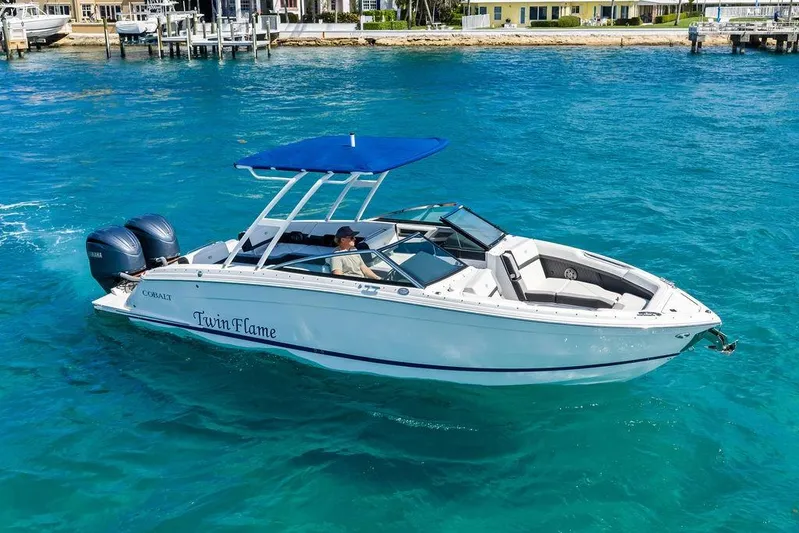 Twin Flame Yacht Photos Pics 2022 Cobalt R8 Outboard boat "Twin Flame" on clear blue water.