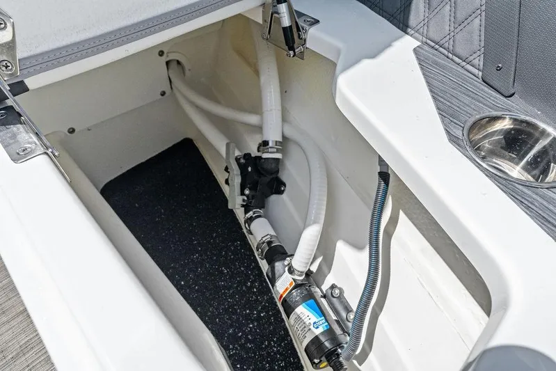 Twin Flame Yacht Photos Pics 2022 Cobalt R8 Outboard boat storage compartment with visible plumbing and wiring.