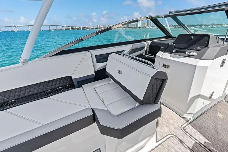 Twin Flame Yacht Photos Pics 2022 Cobalt R8 Outboard boat interior with luxurious seating and scenic ocean view.