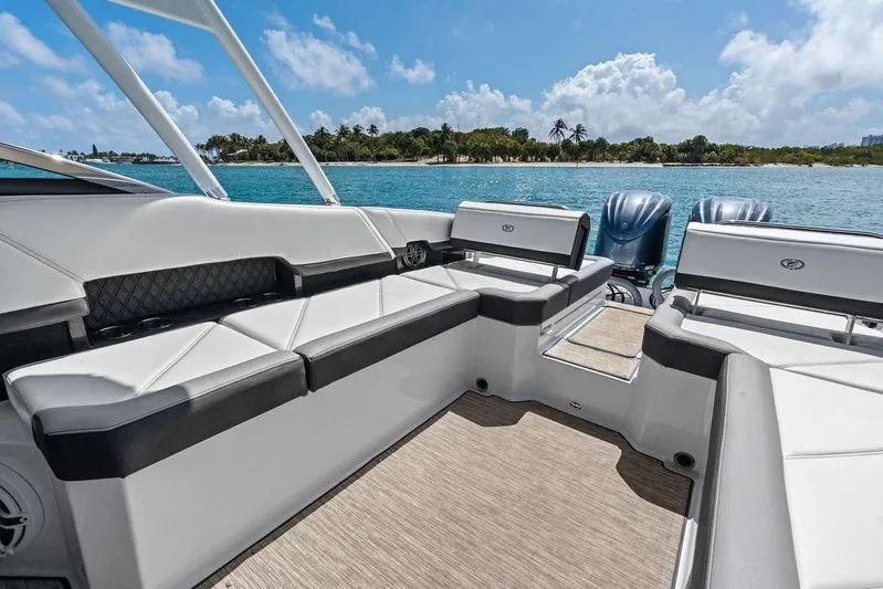 Twin Flame Yacht Photos Pics 2022 Cobalt R8 Outboard boat interior with luxurious seating, ocean view, and clear blue sky.