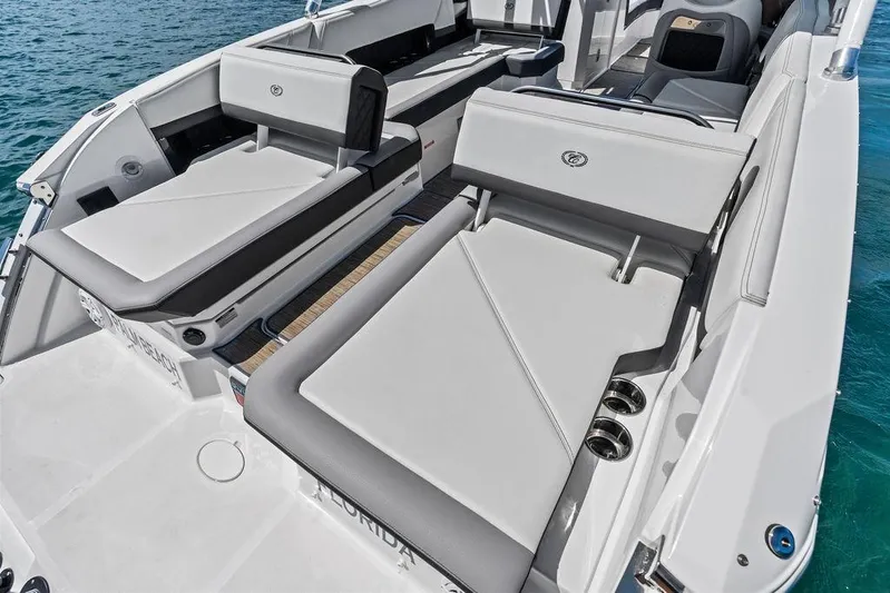 Twin Flame Yacht Photos Pics 2022 Cobalt R8 Outboard boat interior with luxurious seating on the water.