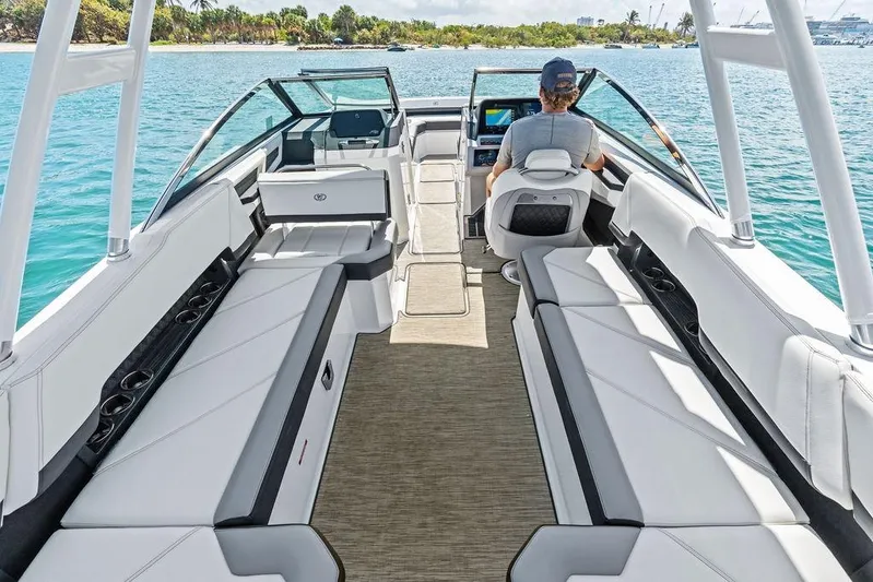Twin Flame Yacht Photos Pics 2022 Cobalt R8 Outboard boat interior with spacious seating and modern design on a sunny day.