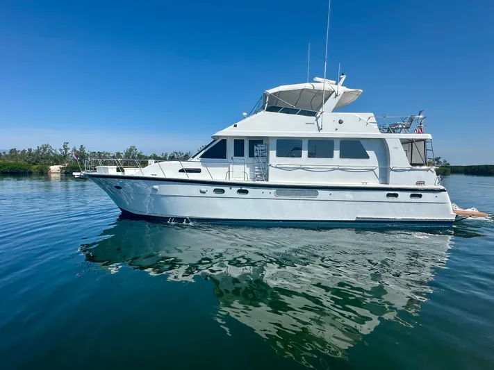 Leslie Jane Yacht Photos Pics 2002 Jefferson Marquessa 57 MY yacht on calm water under clear blue sky.