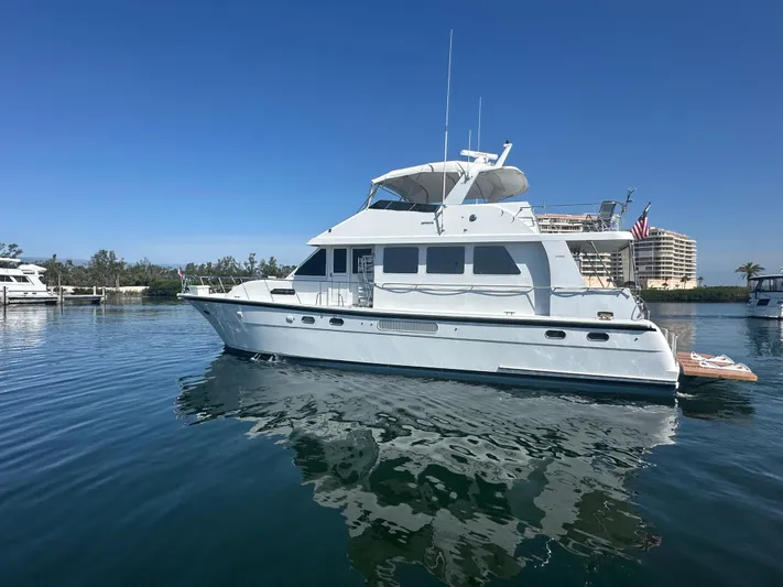 Leslie Jane Yacht Photos Pics 2002 Jefferson Marquessa 57 MY yacht on calm water, clear sky background.