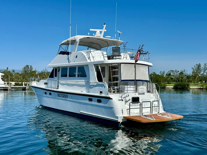 Leslie Jane Yacht Photos Pics 2002 Jefferson Marquessa 57 MY yacht on calm water, clear sky background.