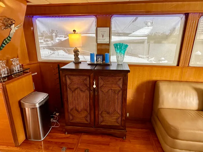 Leslie Jane Yacht Photos Pics Luxurious interior of 2002 Jefferson Marquessa 57 MY yacht with elegant wooden cabinet and decor.