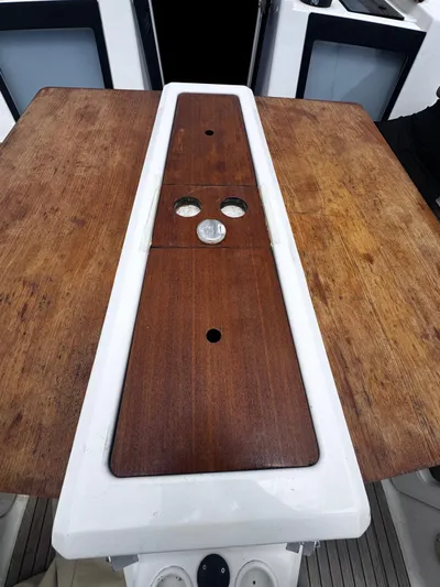  Yacht Photos Pics Dufour 412 Grand Large 2018 yacht cockpit table with wood finish and cup holders.