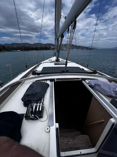  Yacht Photos Pics 2018 Dufour 412 Grand Large sailboat deck with open cabin, moored on a scenic lake.