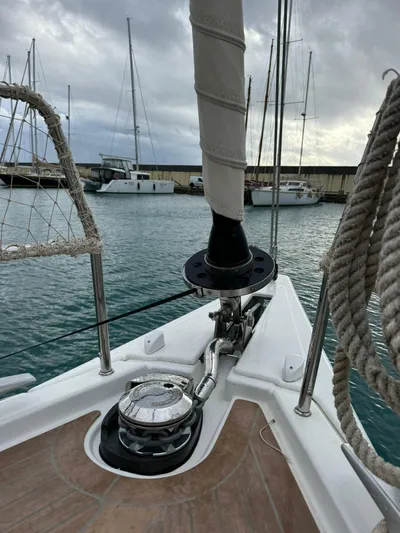  Yacht Photos Pics 2022 Dufour 470 sailboat bow with winch, docked in marina.