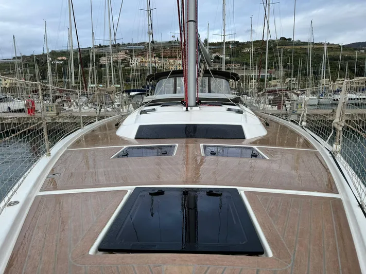  Yacht Photos Pics Dufour 470 sailboat deck, 2022 model, docked in marina with surrounding yachts.