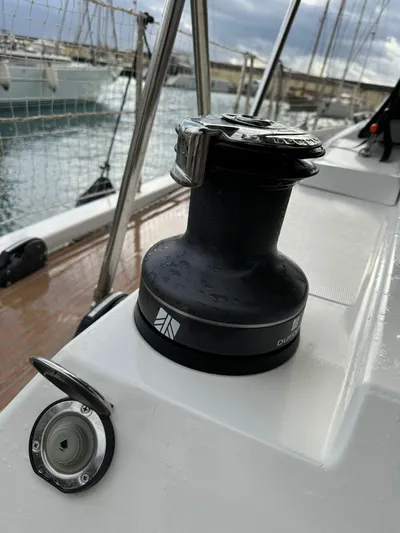  Yacht Photos Pics Winch on 2022 Dufour 470 sailboat deck, marina background.
