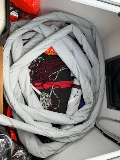  Yacht Photos Pics Coiled ropes and gear in a Dufour 470 sailboat storage compartment, 2022 model.