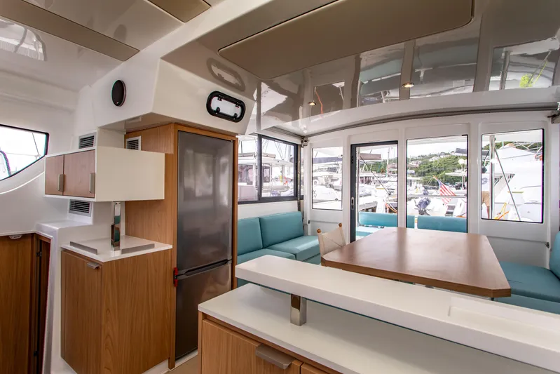 Lucky Fin Yacht Photos Pics Modern interior of 2024 Bali CATSPACE catamaran with sleek design and spacious seating area.
