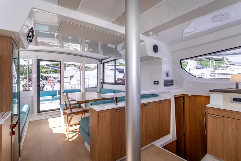 Lucky Fin Yacht Photos Pics 2024 Bali CATSPACE interior with modern design, featuring wood accents and ample natural light.