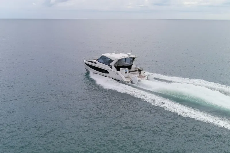  Yacht Photos Pics 2023 Aquila 36 Sport cruising on open water, showcasing sleek design and powerful performance.