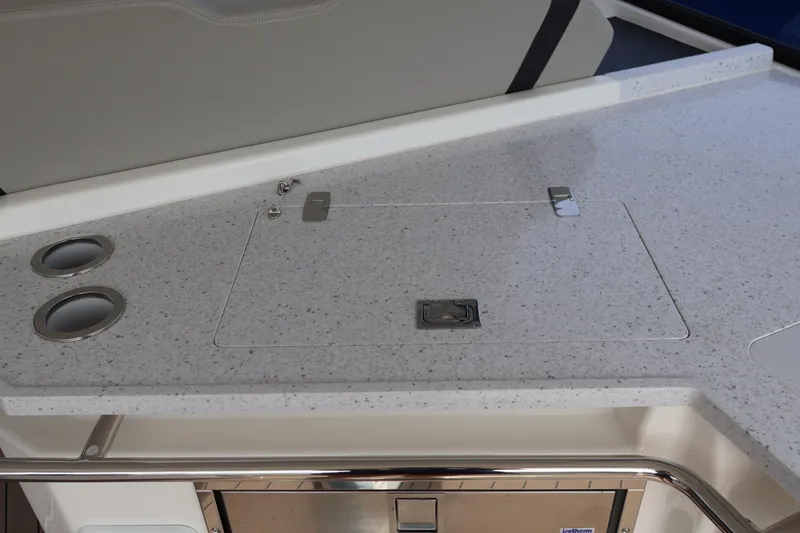  Yacht Photos Pics 2023 Aquila 36 Sport boat interior with sleek countertop and built-in cup holders.