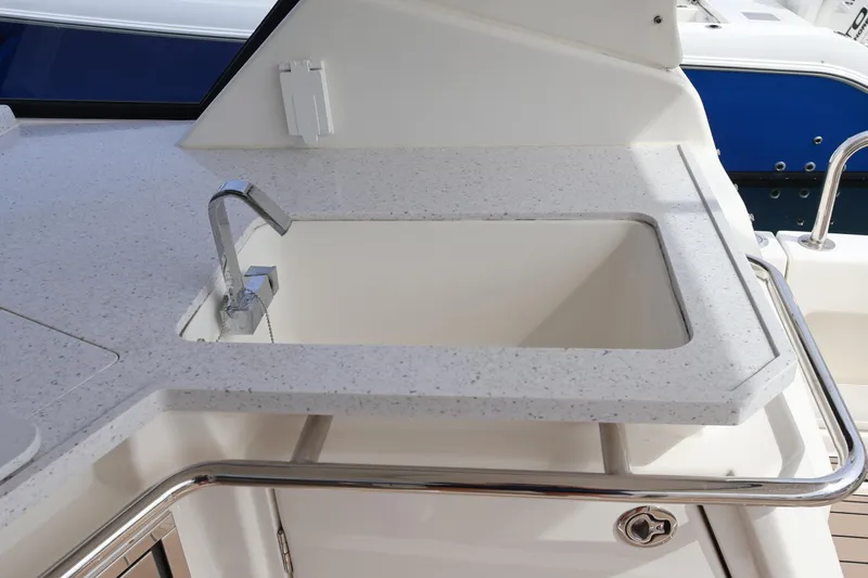  Yacht Photos Pics Aquila 36 Sport 2023 boat sink with modern faucet and sleek countertop design.