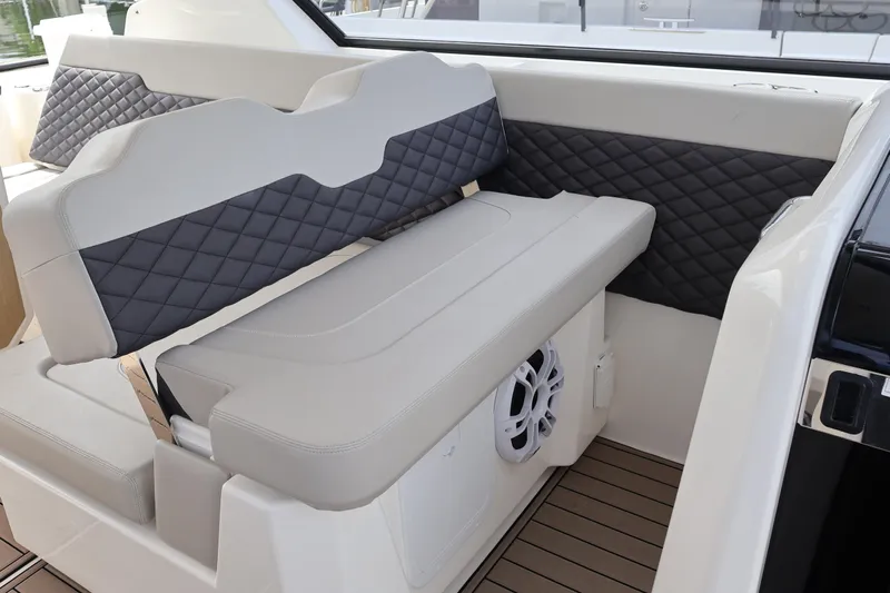  Yacht Photos Pics 2023 Aquila 36 Sport interior with quilted seating and integrated speaker system.
