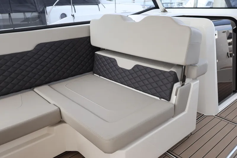  Yacht Photos Pics 2023 Aquila 36 Sport boat interior with quilted seating and modern design.