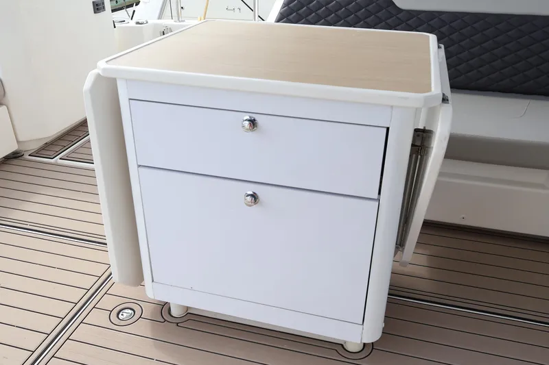  Yacht Photos Pics 2023 Aquila 36 Sport yacht interior with sleek white cabinetry and wood flooring.