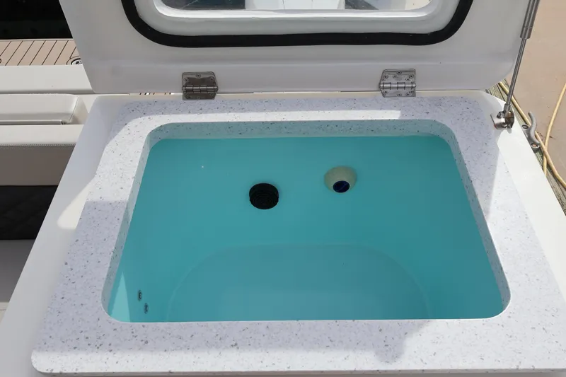  Yacht Photos Pics Livewell on 2023 Aquila 36 Sport boat, featuring a sleek design and modern functionality.