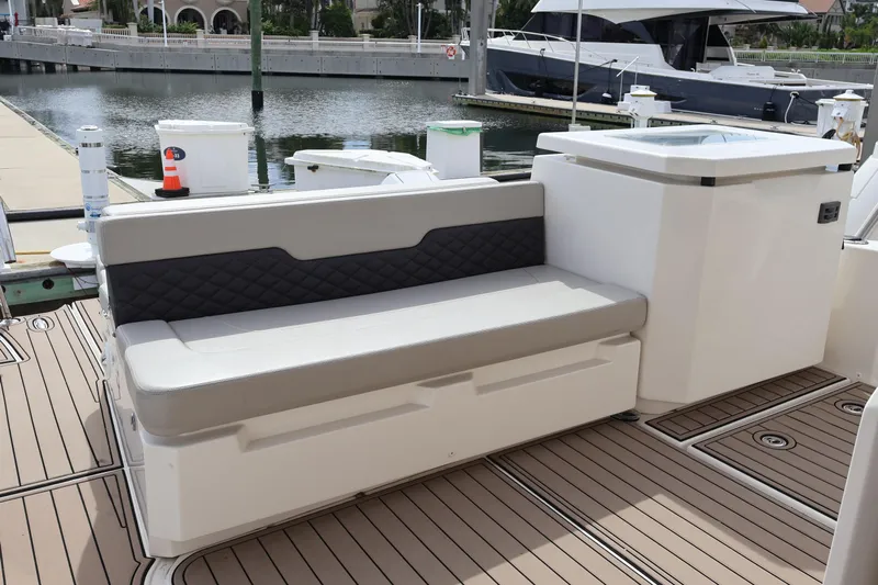  Yacht Photos Pics 2023 Aquila 36 Sport boat seating area with modern design at marina.
