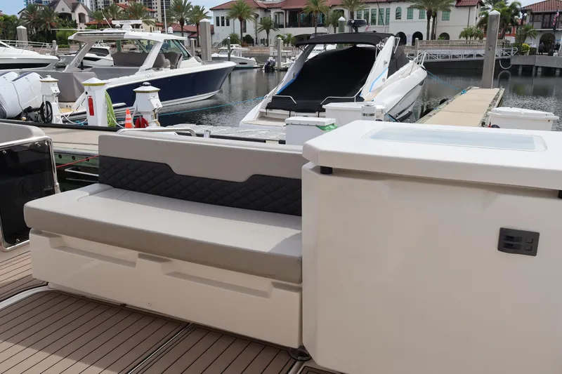  Yacht Photos Pics 2023 Aquila 36 Sport yacht interior with seating and marina view.