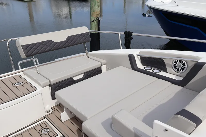  Yacht Photos Pics 2023 Aquila 36 Sport boat interior with cushioned seating and modern design.
