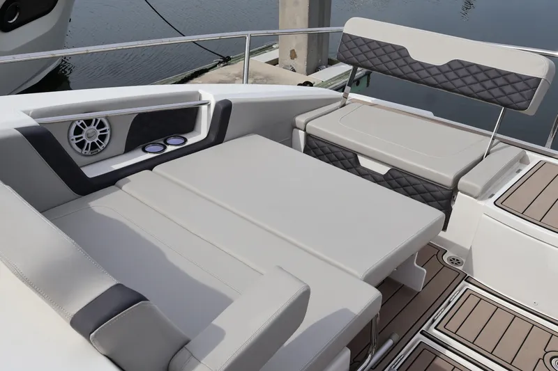  Yacht Photos Pics 2023 Aquila 36 Sport boat interior with cushioned seating and speaker system.