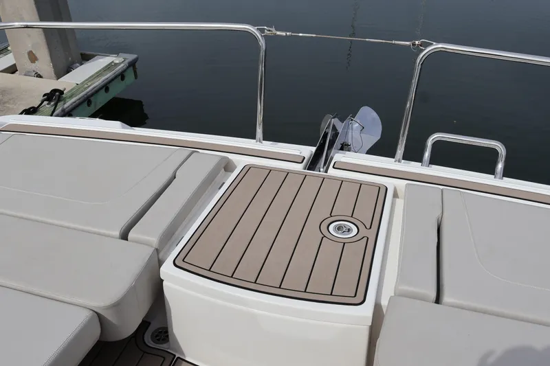  Yacht Photos Pics 2023 Aquila 36 Sport boat deck with cushioned seating and sleek design.