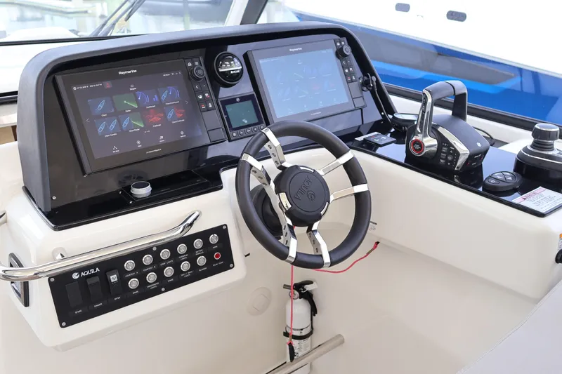  Yacht Photos Pics 2023 Aquila 36 Sport helm with advanced navigation and control systems.