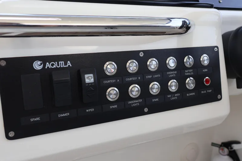  Yacht Photos Pics Control panel of 2023 Aquila 36 Sport boat with various switches and buttons.