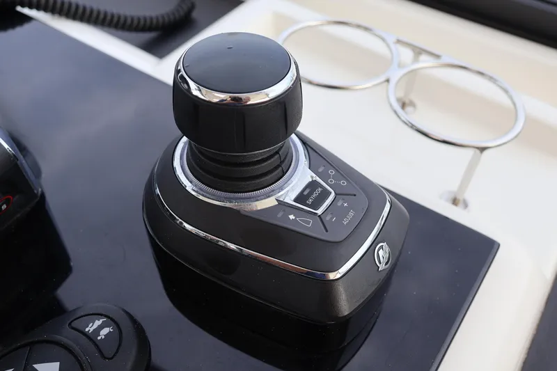  Yacht Photos Pics Joystick control on 2023 Aquila 36 Sport boat dashboard, featuring sleek design and functionality.