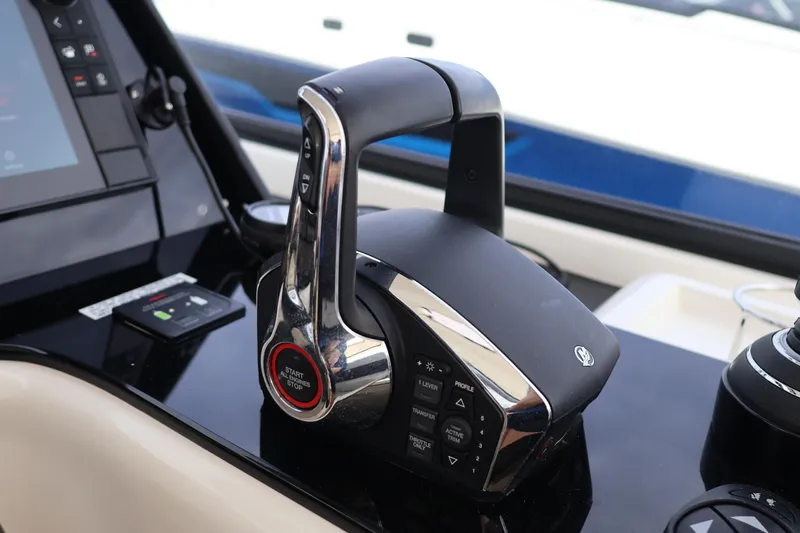  Yacht Photos Pics Control panel of 2023 Aquila 36 Sport boat, featuring modern throttle and navigation controls.
