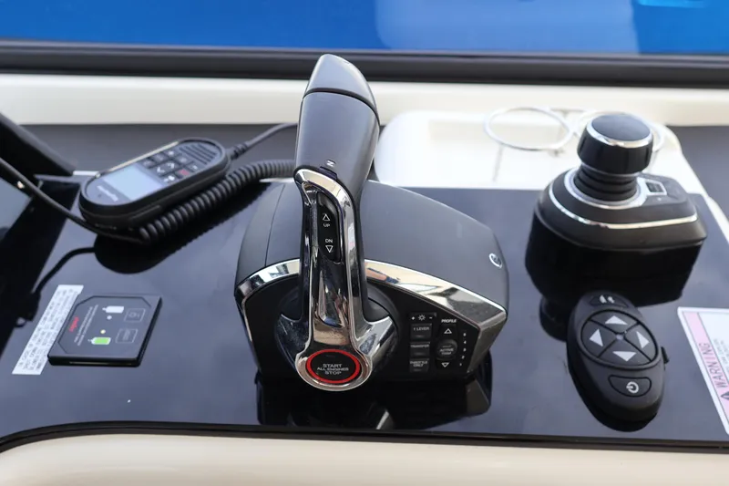  Yacht Photos Pics Control panel of 2023 Aquila 36 Sport boat with throttle and joystick.