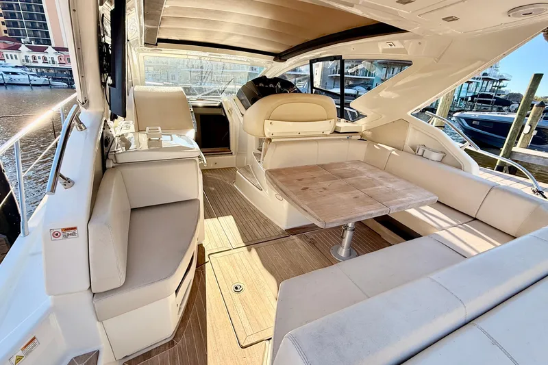  Yacht Photos Pics Luxurious 2016 Cranchi M44 HT yacht interior with elegant seating and wooden table.
