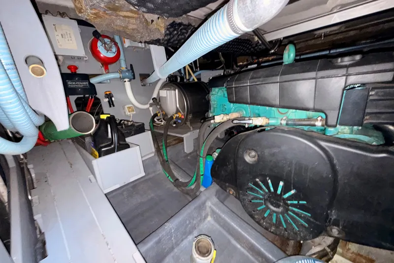  Yacht Photos Pics Engine room of 2016 Cranchi M44 HT yacht, showcasing mechanical components and hoses.