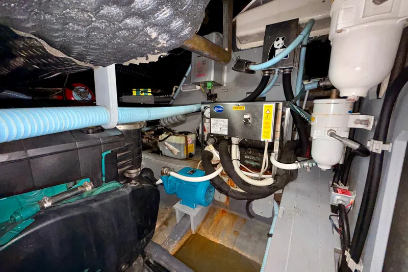  Yacht Photos Pics Engine room of 2016 Cranchi M44 HT yacht, showcasing mechanical components and wiring.