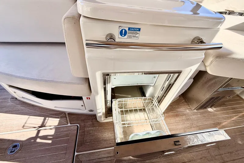  Yacht Photos Pics Open refrigerator on 2016 Cranchi M44 HT yacht, showcasing interior storage space.