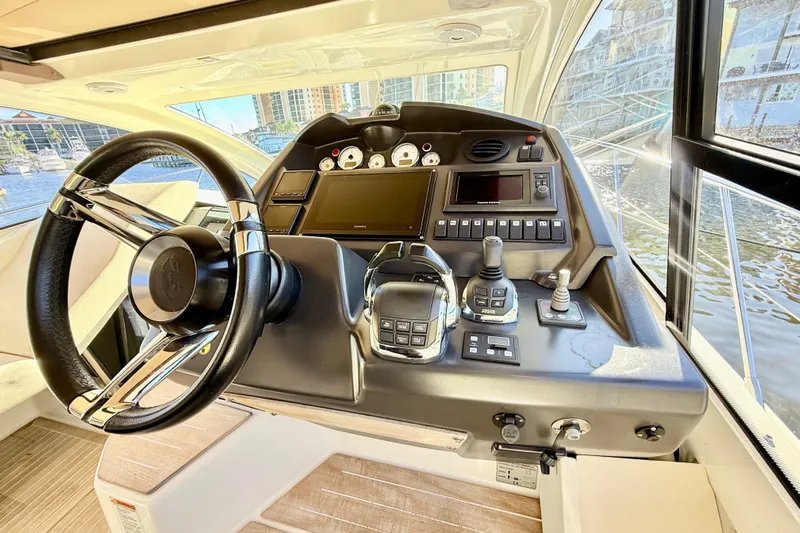 Yacht Photos Pics Helm of 2016 Cranchi M44 HT yacht with modern controls and steering wheel.