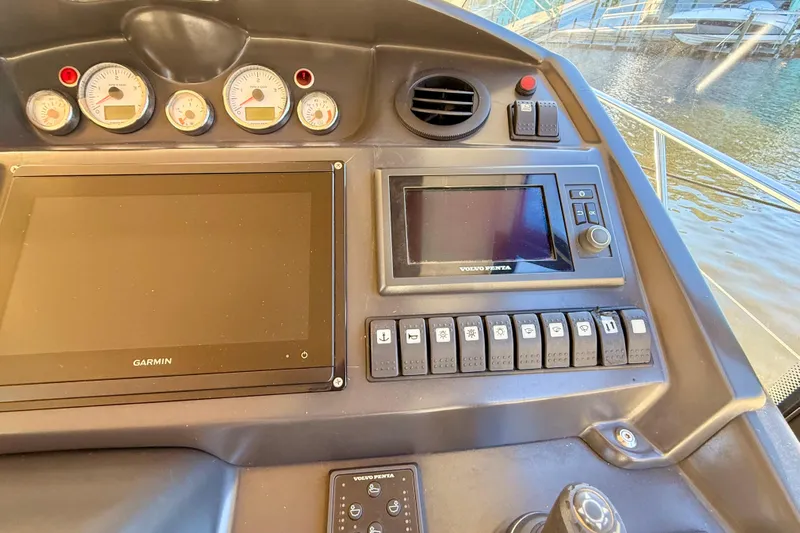  Yacht Photos Pics Control panel of 2016 Cranchi M44 HT yacht with Garmin and Volvo Penta displays.