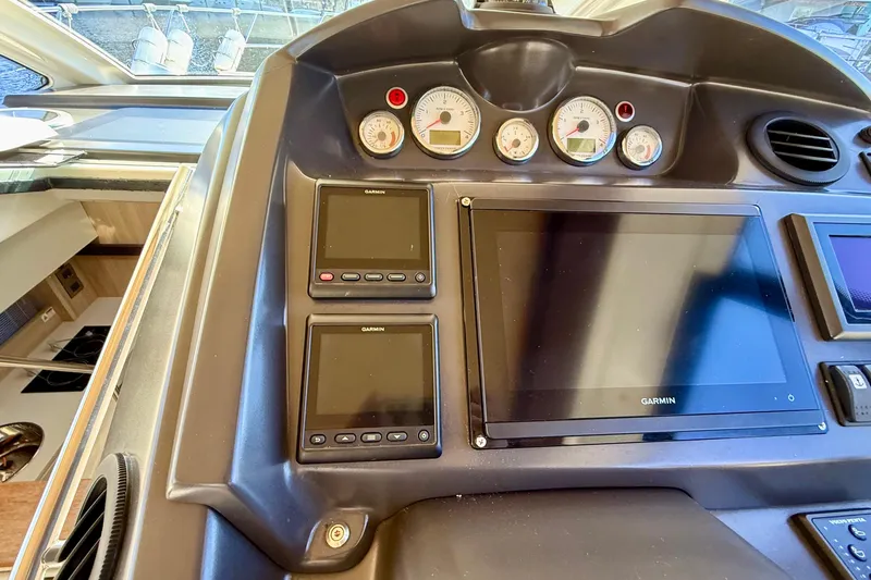  Yacht Photos Pics Control panel of 2016 Cranchi M44 HT yacht with Garmin displays and gauges.