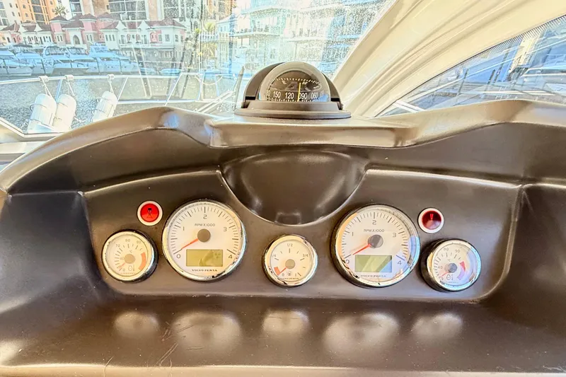  Yacht Photos Pics Dashboard of 2016 Cranchi M44 HT yacht with gauges and compass.