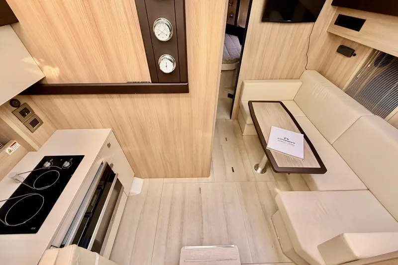  Yacht Photos Pics Interior of 2016 Cranchi M44 HT yacht with modern kitchen and seating area.