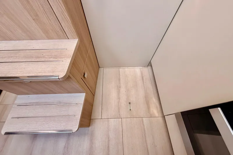  Yacht Photos Pics Interior of 2016 Cranchi M44 HT yacht with wooden steps and flooring.