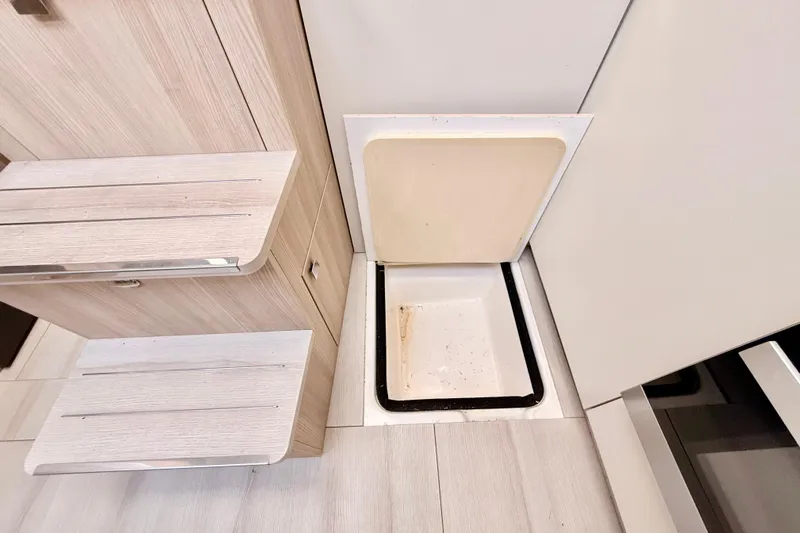  Yacht Photos Pics Hidden storage compartment on 2016 Cranchi M44 HT yacht interior.