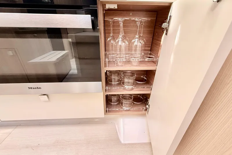  Yacht Photos Pics Modern kitchen cabinet with glassware storage on a 2016 Cranchi M44 HT yacht.