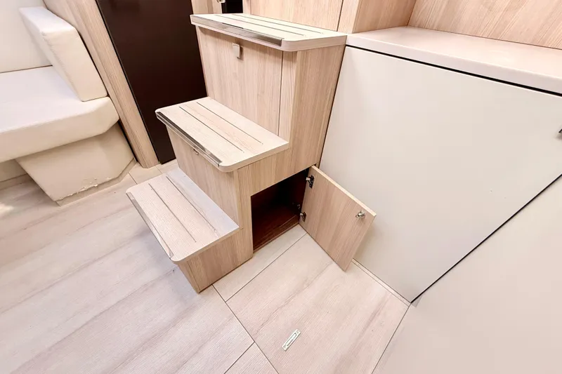  Yacht Photos Pics Interior of 2016 Cranchi M44 HT yacht with wooden steps and storage compartment.