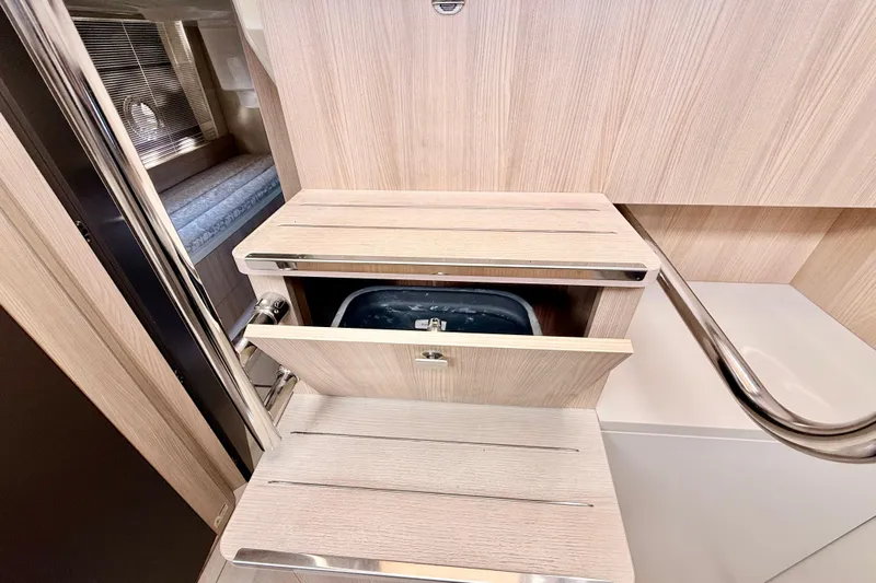  Yacht Photos Pics Interior of 2016 Cranchi M44 HT yacht with wooden cabinetry and modern design.