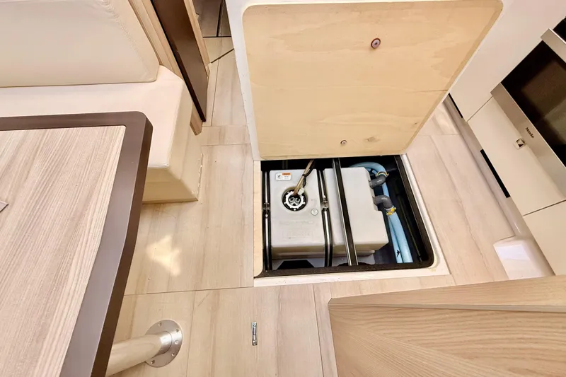  Yacht Photos Pics 2016 Cranchi M44 HT yacht interior showing underfloor storage compartment.